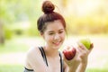 Apple in asian girl hand, green or red apple