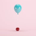 Apple attached with blue balloon on pink background