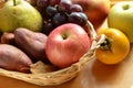 Apple and autumn fruits in a basket Royalty Free Stock Photo