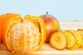 Apple, Bananas, mandarines on table Royalty Free Stock Photo