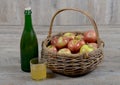 Apple basket and bottle with a glass cider
