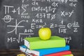 apple books pile near chalkboard. High quality photo Royalty Free Stock Photo