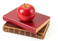Apple on books stacked for learning and knowledge acquisition Royalty Free Stock Photo