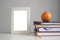 Apple on books, white frame. Back to school, study concept. Royalty Free Stock Photo