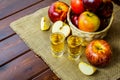 Apple brandy shots and red apples Royalty Free Stock Photo