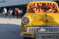 Apple car installation. Yellow soviet motor car exhibit Apple Moskvitch