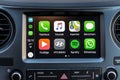 Apple CarPlay apps on screen in car dashboard