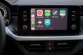 Apple CarPlay screen in the car dashboard. Youtube music, Waze, 2GIS, Here WeGo, Sygic, TomTom Go logo on the screen in