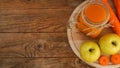 Apple and carrot juice in glass, fresh vegetables and fruits on wooden Royalty Free Stock Photo