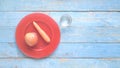 Apple and carrot on a red plate and a glass of water, dieting, healthy nutrion Royalty Free Stock Photo