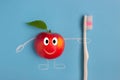 Apple character holding a toothbrush Royalty Free Stock Photo