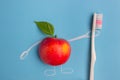 Apple character holding a toothbrush Royalty Free Stock Photo