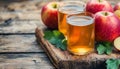 Apple cider and fruit on wooden background Royalty Free Stock Photo