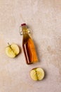 Apple Cider Vinegar Bottle on Concrete Background Vertical Harvest Autumn
