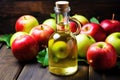 apple cider vinegar in a clear bottle with fresh apples Royalty Free Stock Photo
