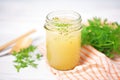 apple cider vinegar detox drink with parsley sprig