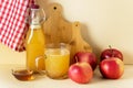 Apple Cider Vinegar in Glass Mug and Bottle with Honey and Cinnamon Red Apples Yellow Background Horizontal Royalty Free Stock Photo