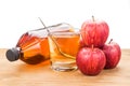 Apple cider vinegar in jar, glass and fresh apple, healthy drink