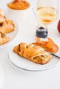 Apple cinnamon pastry rolls on white wooden table Royalty Free Stock Photo