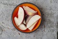 Apple with cinnamon. Sliced apple with cinnamon. Apple slices in a plate