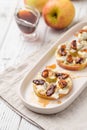 Apple circles with cream cheese, gorgonzola and spicy almond nuts Royalty Free Stock Photo