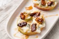 Apple circles with cream cheese, gorgonzola and spicy almond nuts Royalty Free Stock Photo