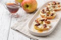 Apple circles with cream cheese, gorgonzola and spicy almond nuts Royalty Free Stock Photo