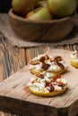 Apple circles with cream cheese, gorgonzola and spicy almond nuts Royalty Free Stock Photo