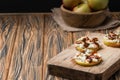 Apple circles with cream cheese, gorgonzola and spicy almond nuts Royalty Free Stock Photo