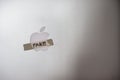 Apple company logo with a tape written FAKE word