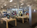 Apple Computers, Laptops, iPhone X and iPad with siri assistant on display inside a Best Buy Royalty Free Stock Photo