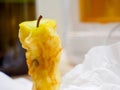Apple core with tissue paper in the background Royalty Free Stock Photo