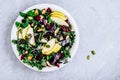 Apple Cranberry Kale Salad bowl with dry cranberries, almonds and pumpkin seeds