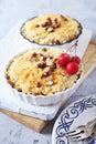 Apple crumble with almonds, two portions, red paradise apples dressing Royalty Free Stock Photo