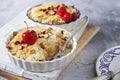 Apple crumble with almonds, two portions, red paradise apples dressing Royalty Free Stock Photo