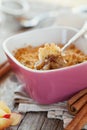 Apple crumble with cinnamon on rustic table Royalty Free Stock Photo