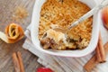 Apple crumble with cinnamon on rustic table Royalty Free Stock Photo