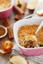 Apple crumble with cinnamon on rustic table Royalty Free Stock Photo