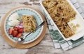 Apple crumble dessert with strawberries and vanilla cream