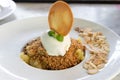 Apple crumble dessert with vanilla ice cream