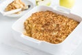 Apple crumble pie in white baking dish Royalty Free Stock Photo