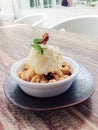 Apple crumble topped with ice-cream Royalty Free Stock Photo