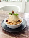 Apple crumble topped with ice-cream Royalty Free Stock Photo