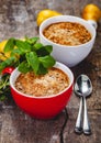 Apple crumble in two cups on wooden rustic background. Royalty Free Stock Photo