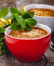 Apple crumble in two cups on wooden rustic background. Royalty Free Stock Photo