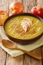 Apple curry soup puree with cinnamon close-up in a plate. vertical Royalty Free Stock Photo