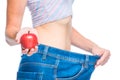 Apple diet in action, focus on apple in hand Royalty Free Stock Photo