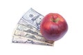 Apple and dollars isolated on a white