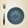 Apple drawn with chalk in a plate Royalty Free Stock Photo