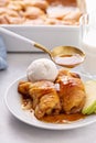 Apple dumplings in flaky pastry with caramel sauce